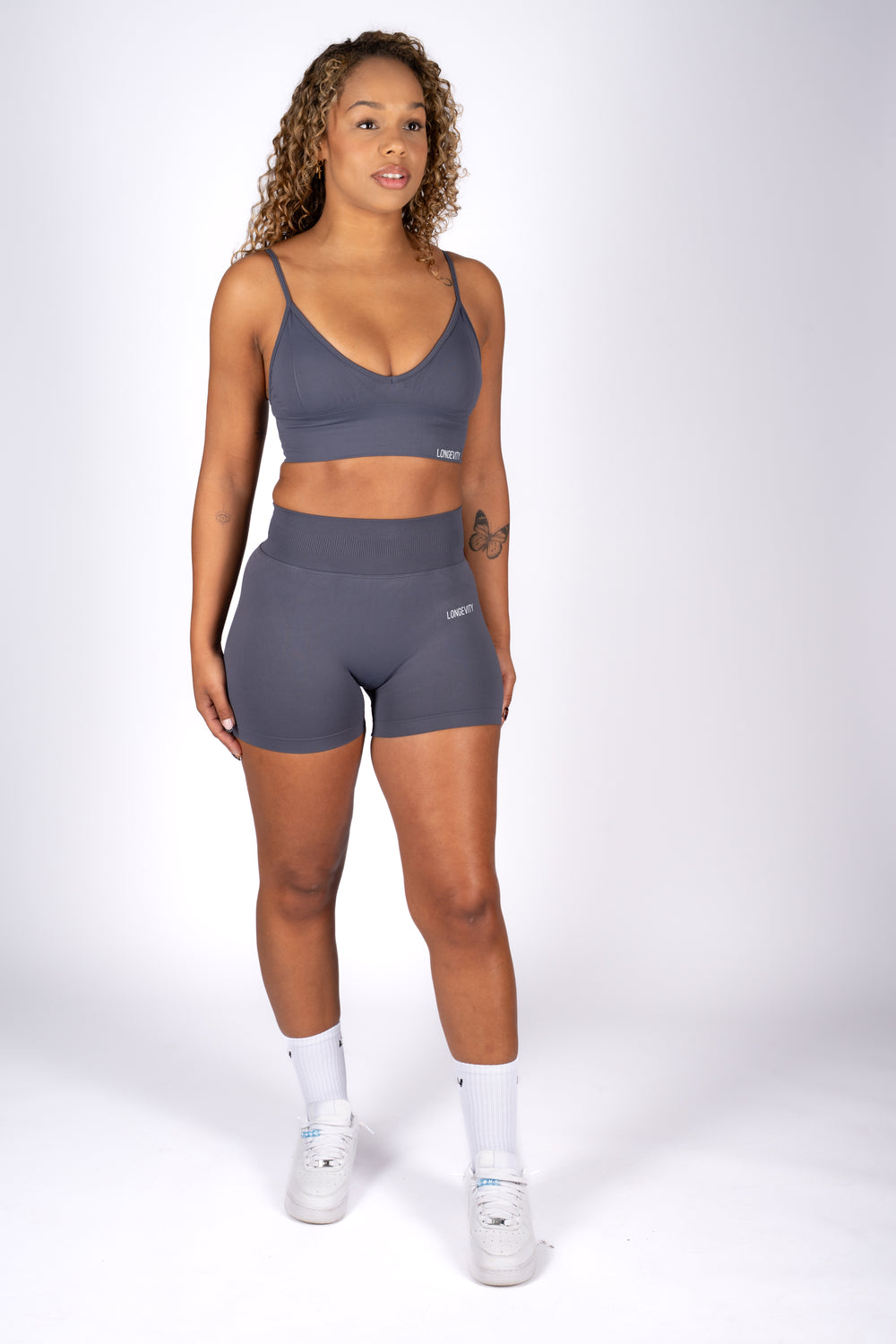 Model wearing soft blue high-waist shorts front view