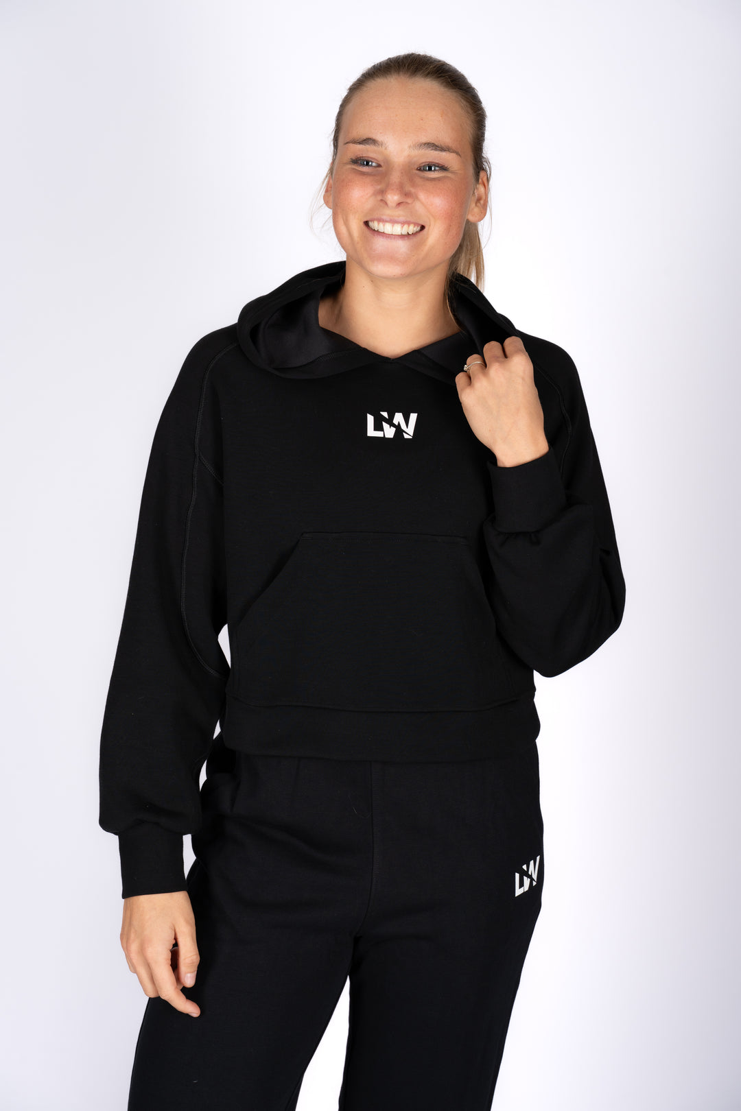 Model wearing Longevity Hoodie – minimalist women’s black hoodie