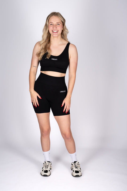 Model wearing high-waist black active shorts