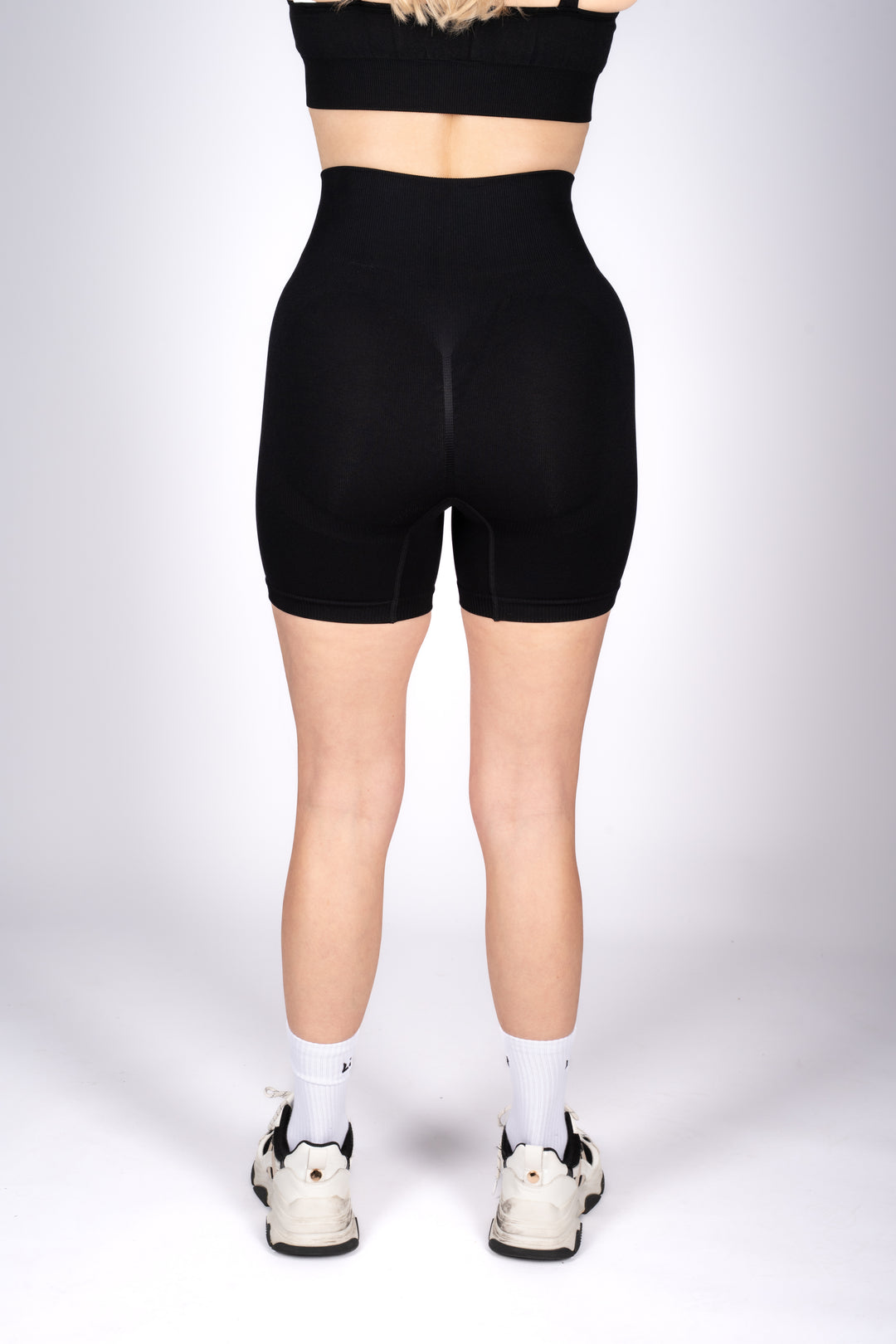 Women’s black workout shorts flat lay