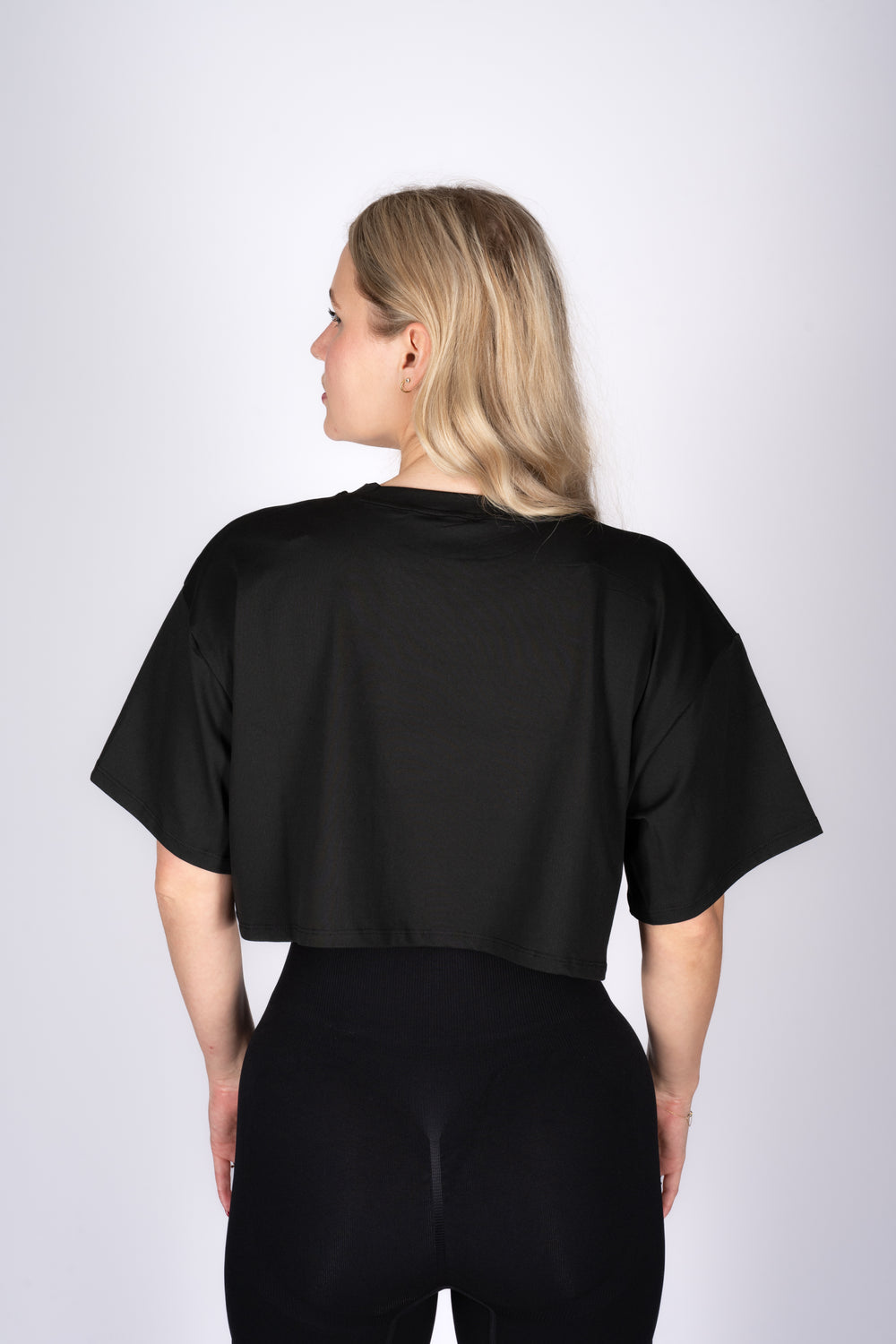 Fitted black crop top side view