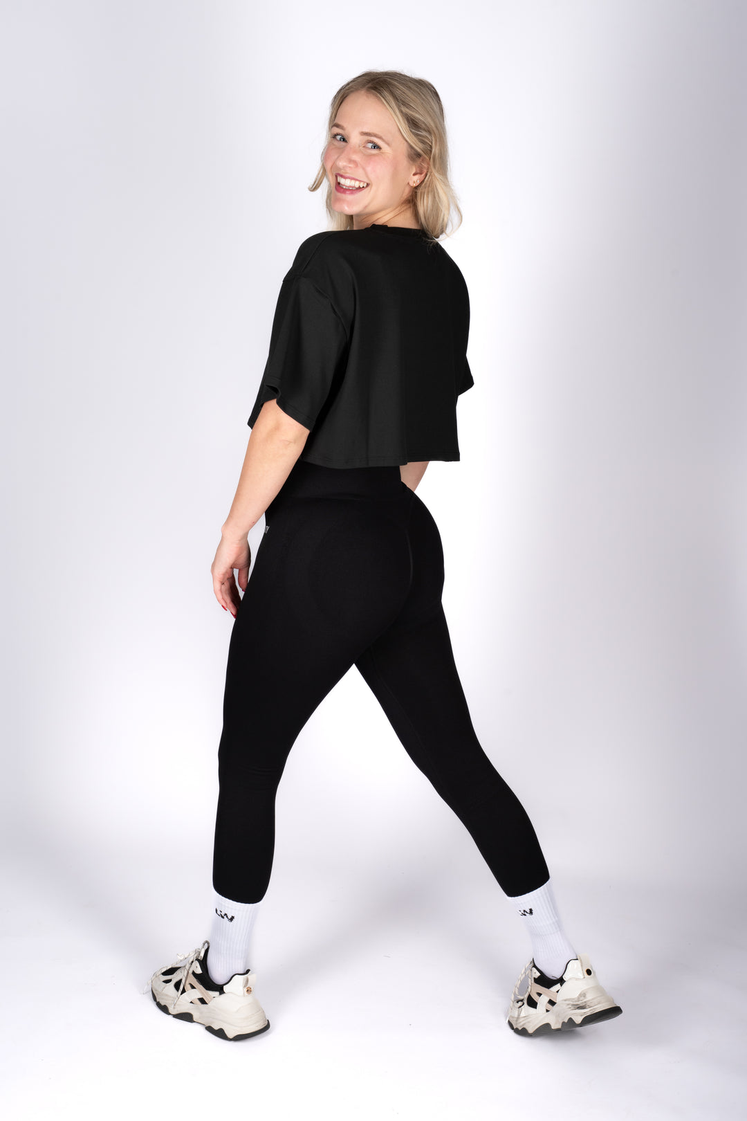 Model wearing minimalist black crop top